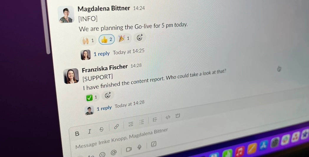 Computer Screen of a Slack chat with Labels [INFO] and [SUPPORT]
